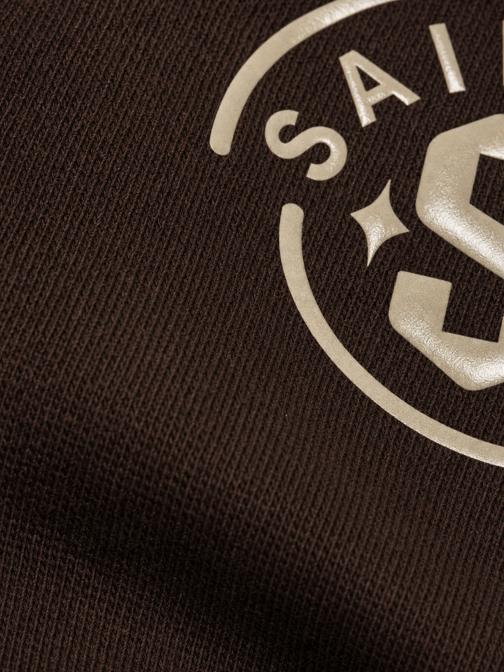 Saints Be Autyst Quarter Zip Brown T-Shirt – close-up detail