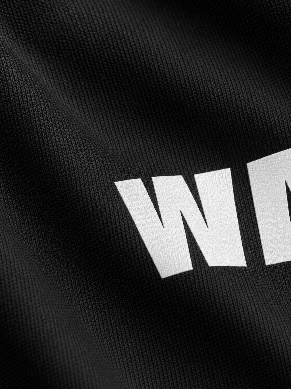 Be Autyst Most Wanted Black T-Shirt – close-up detail